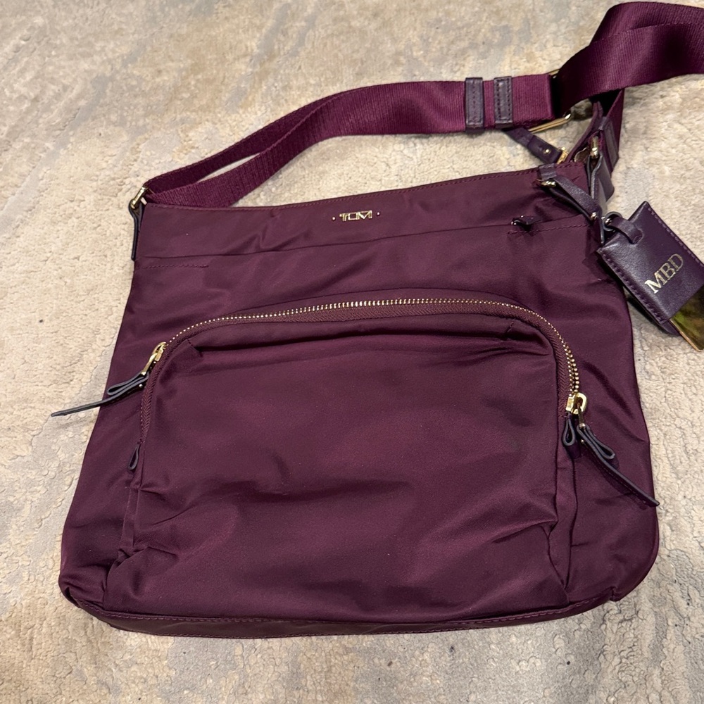 TUMI
Voyageur Capri Crossbody plum purple color in GUC - Picture 2 of 12